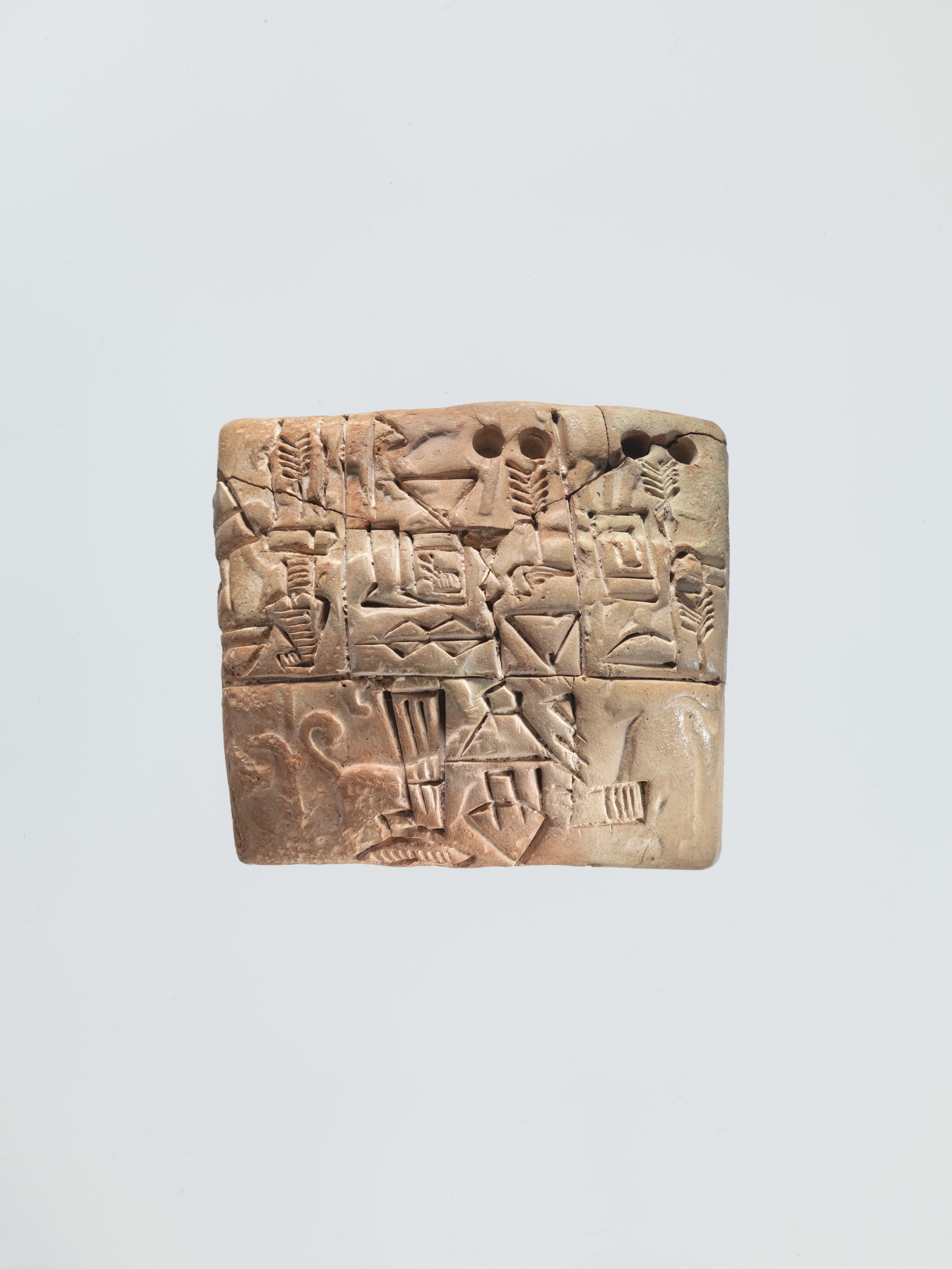 Proto-Cuneiform tablet with seal impressions: administrative account of barley distribution with cylinder seal impression of a male figure, hunting dogs, and boars